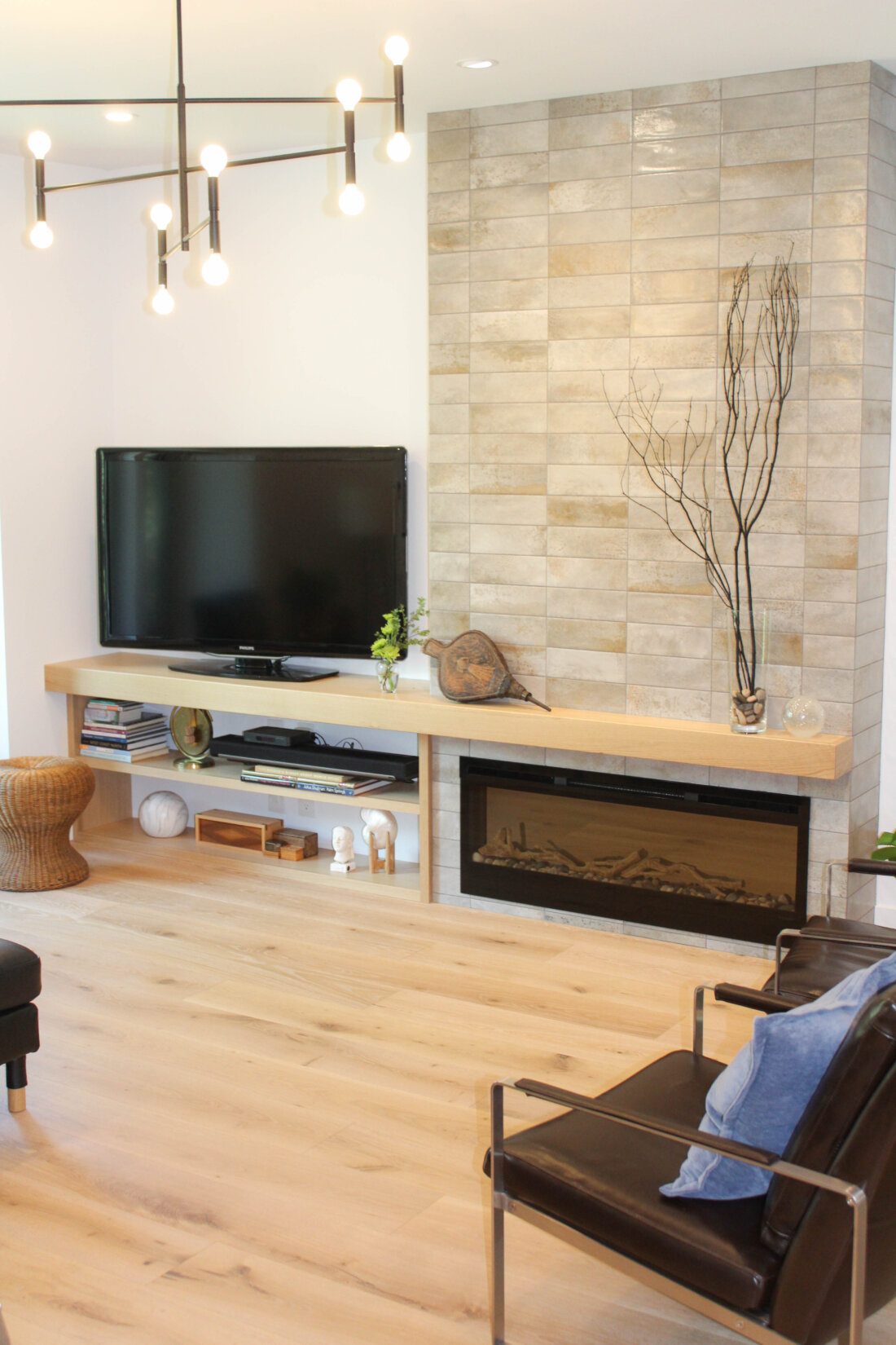 The sunken living room features a low profile electric fireplace.