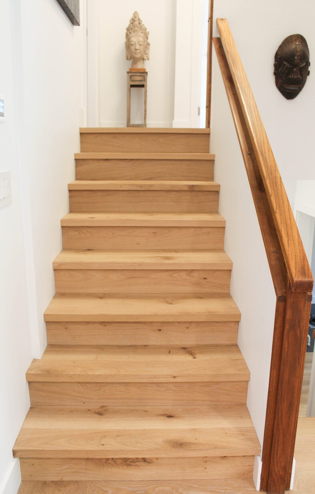 The original honey-coloured oak banister.